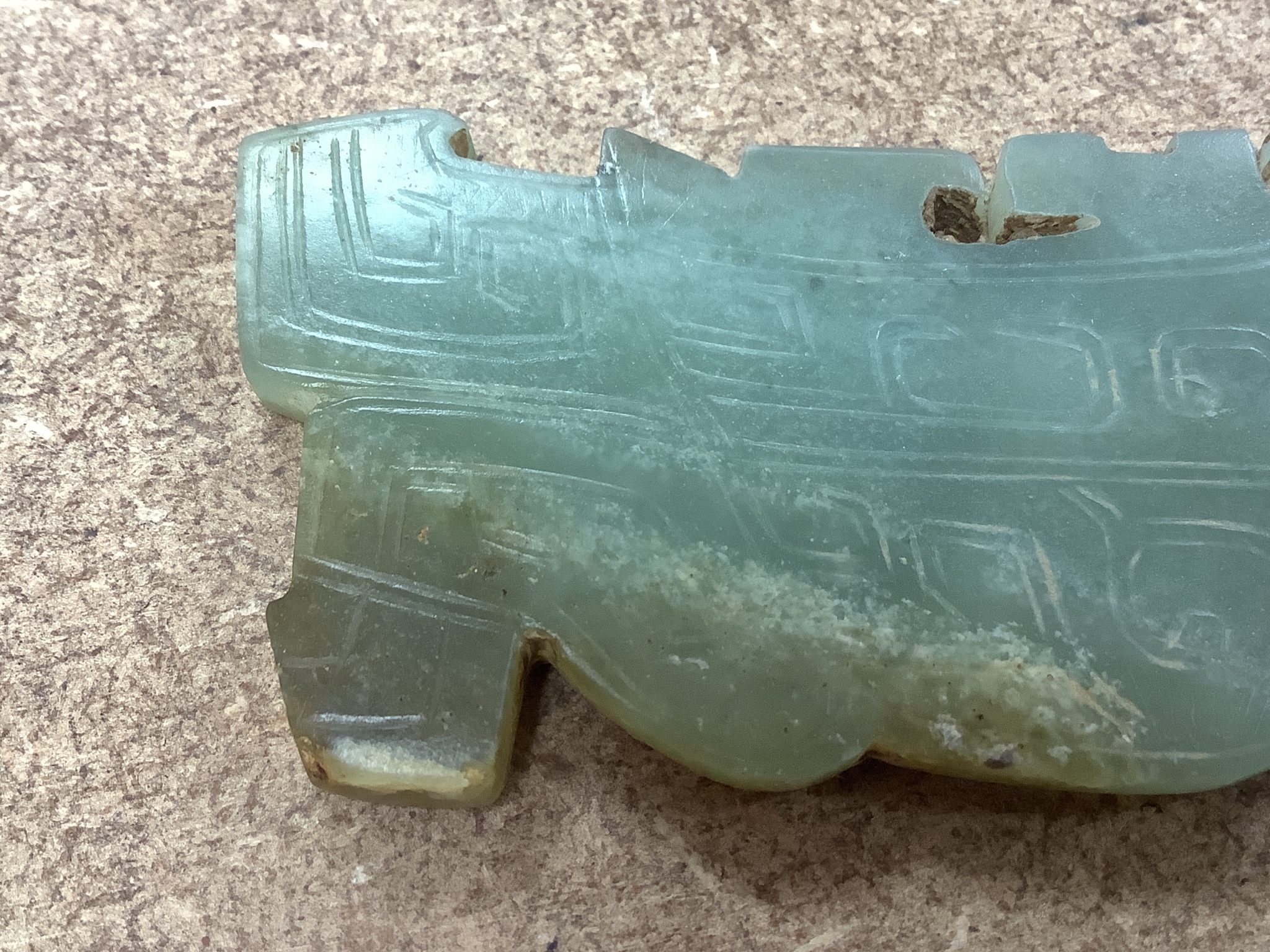 A Chinese archaistic green jade plaque, width 9cm